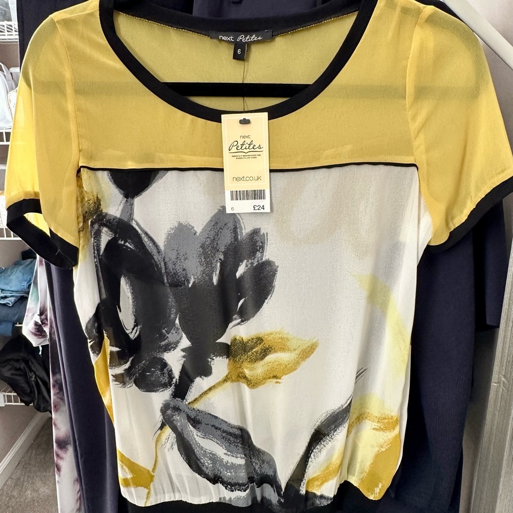 Beautiful blouse bought from Next in England. With tags still on never worn.